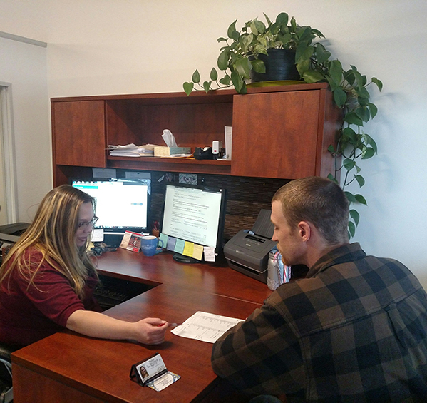 Emily-helping-a-client-2